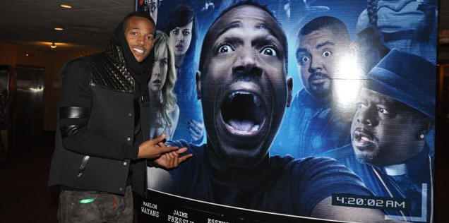 Marlon Wayans Poses with A Haunted House Movie Poster
