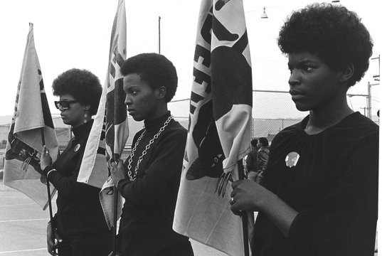 Women holding Black Panther flags. Courtesy of Pirkle Jones and Ruth-Marion Baruch