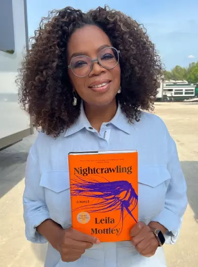 Oprah-Winfrey-Holding-Nightcrawling-book.webp